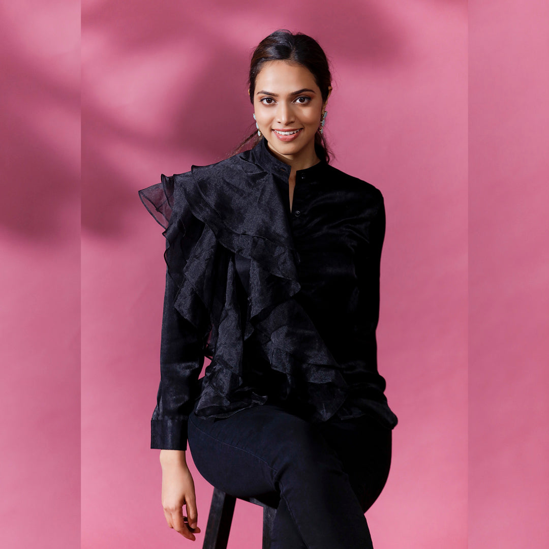 DREAMY ORGANZA RUFFLED SHIRT - This shirt features ruffles made from a sheer and lightweight fabric called organza which creates an ethereal and delicate look. The ruffles create depth and movement giving it a bold and voluminous look too.