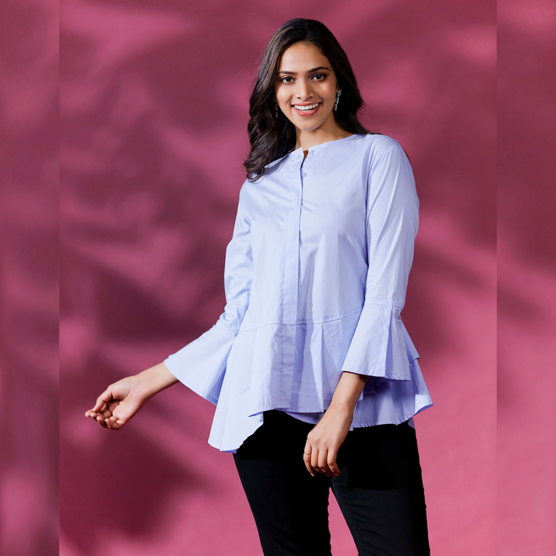 CIRCULAR FRILL SHIRT - This is a classic and stylish shirt with circular frills around the hemline. It is designed with a relaxed fit to provide comfort and ease of movement.