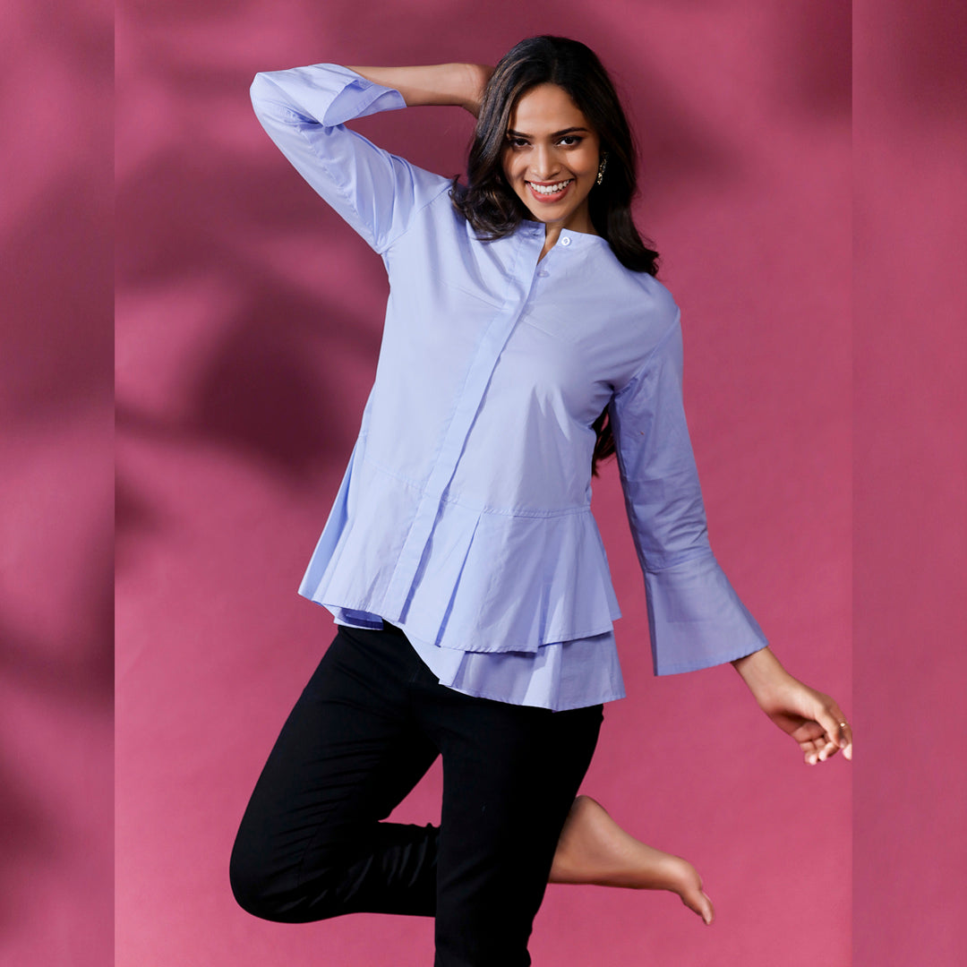 CIRCULAR FRILL SHIRT - This is a classic and stylish shirt with circular frills around the hemline. It is designed with a relaxed fit to provide comfort and ease of movement.