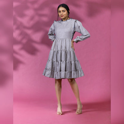 ROMANTIC TIERED DRESS - This knee length dress is a perfect blend of style and comfort, designed for a relaxed and laid-back look. It features multiple tiers of soft fabric that create a unique and feminine silhouette.