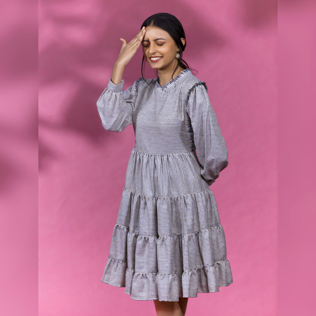 ROMANTIC TIERED DRESS - This knee length dress is a perfect blend of style and comfort, designed for a relaxed and laid-back look. It features multiple tiers of soft fabric that create a unique and feminine silhouette.